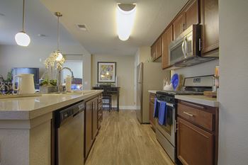 Plush carpet and wood grain flooring